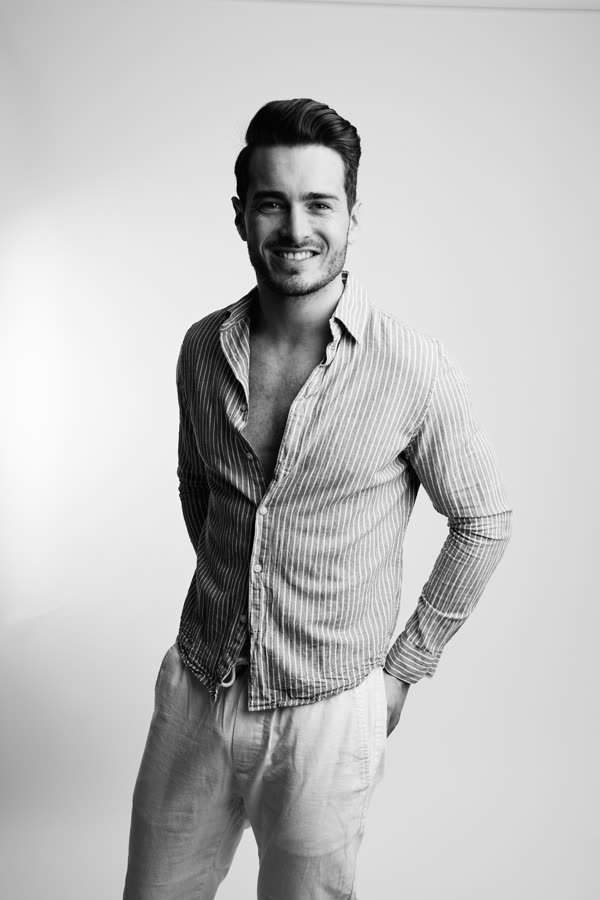 Andreas Schmid, black and white studio photo, smiling
